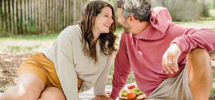 Happy couple enjoying picnic together