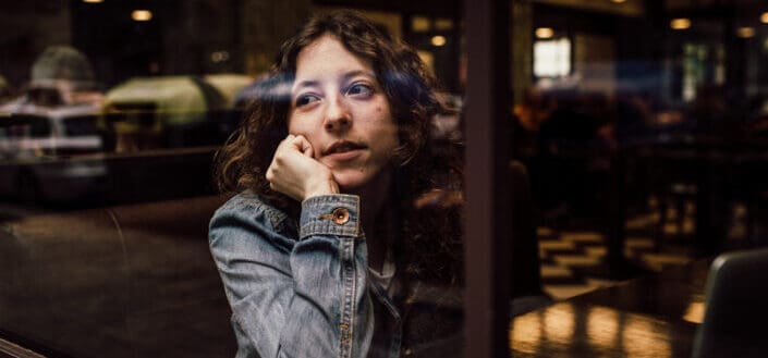 Woman Looking Outside The Window