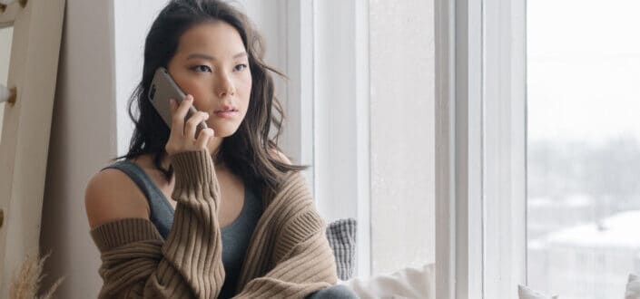 Serious Woman Answering Her Phone