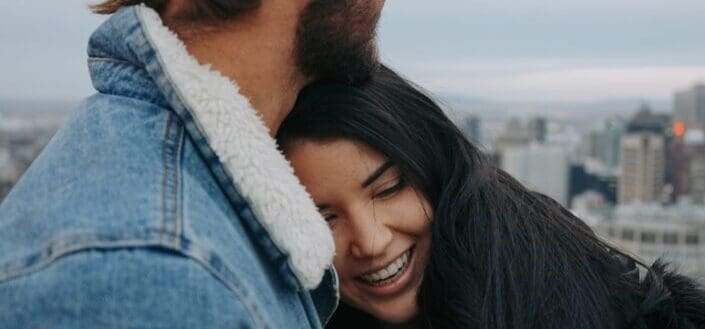 Guy hugging girl. - signs he loves you