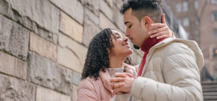 couple tends to kiss along the stairway