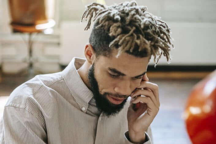 Guy talking on a phone.