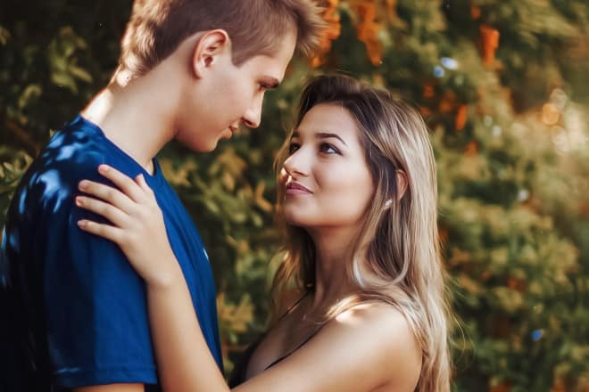 couple about to kiss - signs he loves you