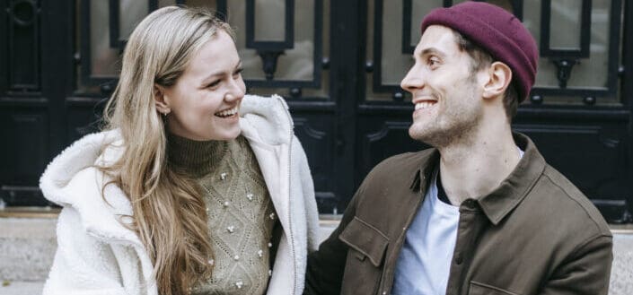 Couple on a happy conversation while having a coffee.
