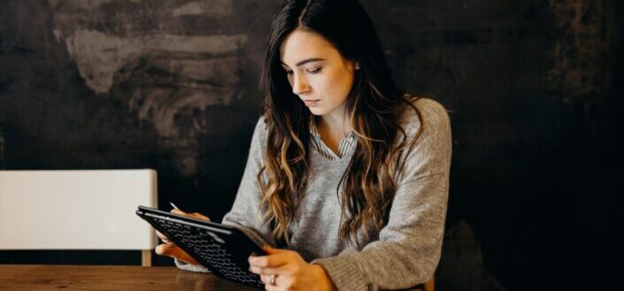 Woman working on her tablet
