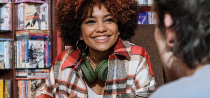 Happy woman listening to a man