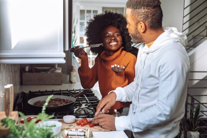 A couple cooking a meal together