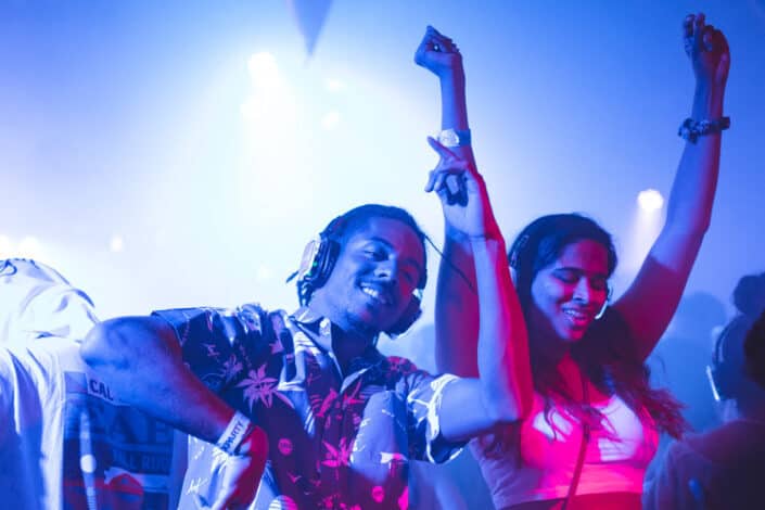 A couple dancing at a concert