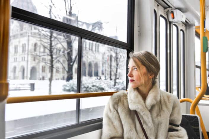 A woman looking out of the bus