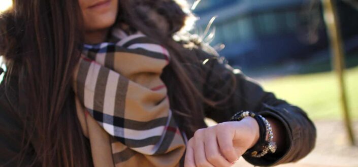Girl checking time on her wristwatch