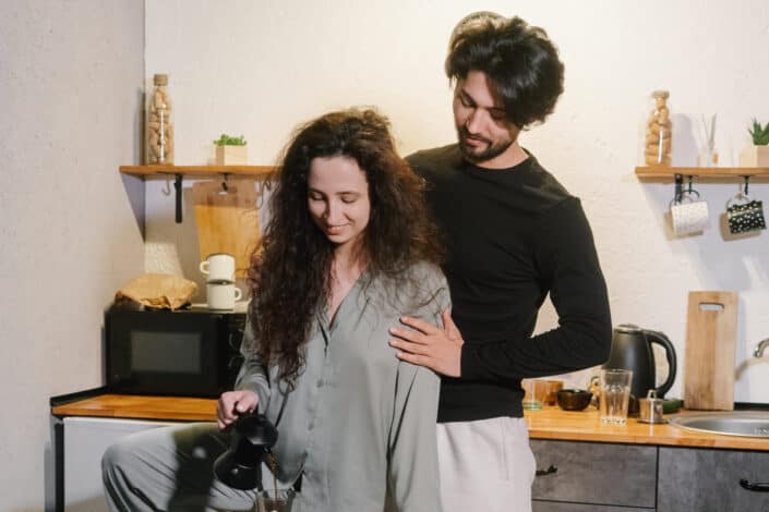 couple being sweet at making coffee