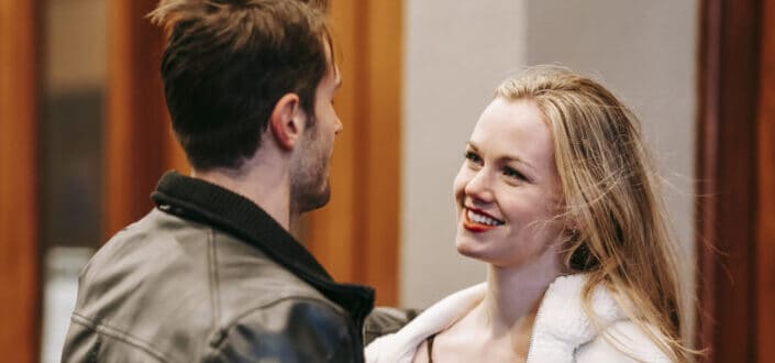 cheerful woman smiling cheekily to his boyfriend
