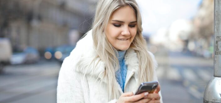 A girl in a city using smartphone