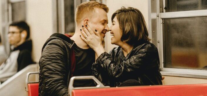 romantic couple at public transportation