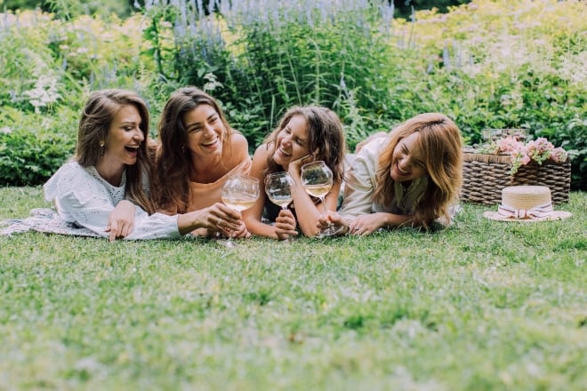 women enjoying their drinks - questions to ask a girl 