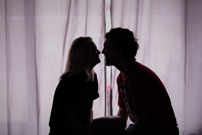 Silhouette of couple about to kiss