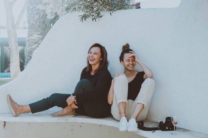 Two friends spending a fun time together and laughing.