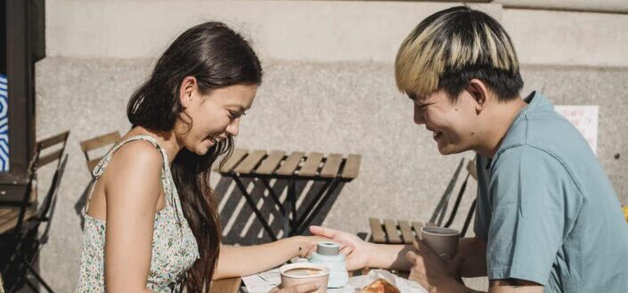 young couple flirting with each other under daylight