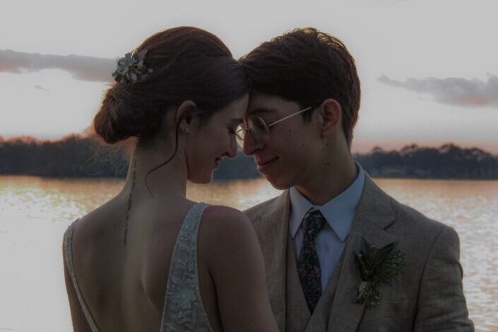a romantic couple on a date near a lake
