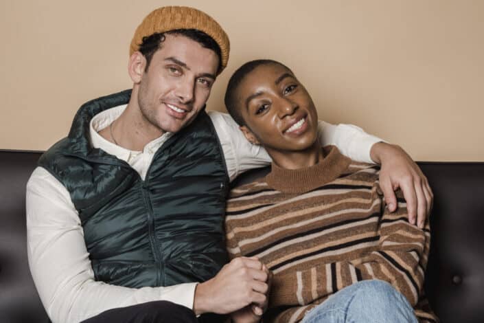 romantic couple cuddling on sofa
