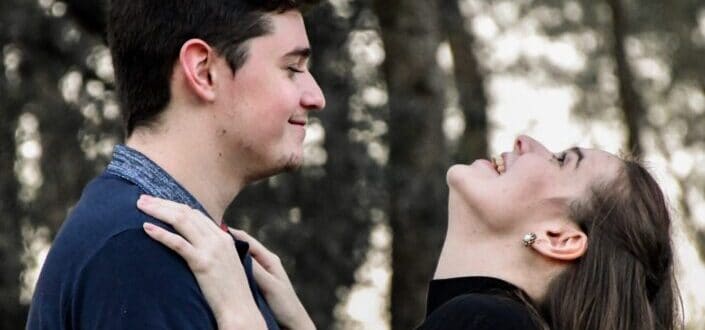 girl giggling while hugging his partner