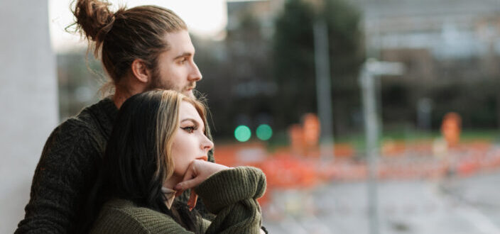 couple embracing each other at the balcony