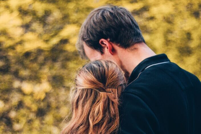 couple hugging side by side