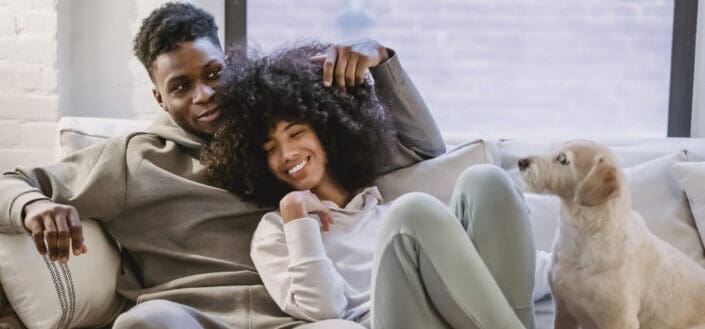 romantic couple chilling on couch 