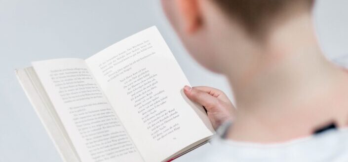 Reading a book.