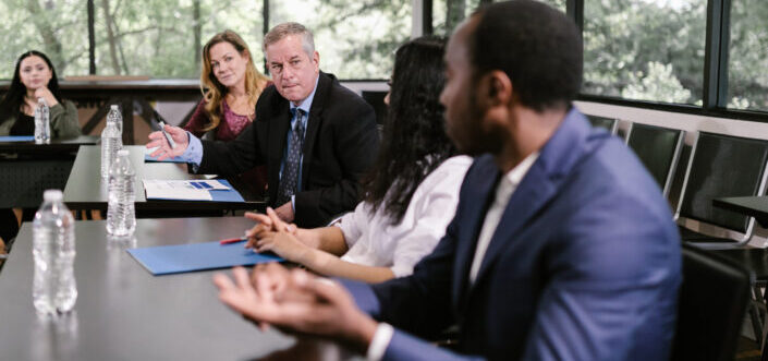 Group of professionals having a discussion inside the conference room.