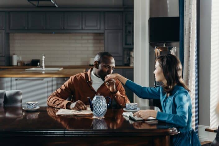 Man Kissing the Hand of a Woman