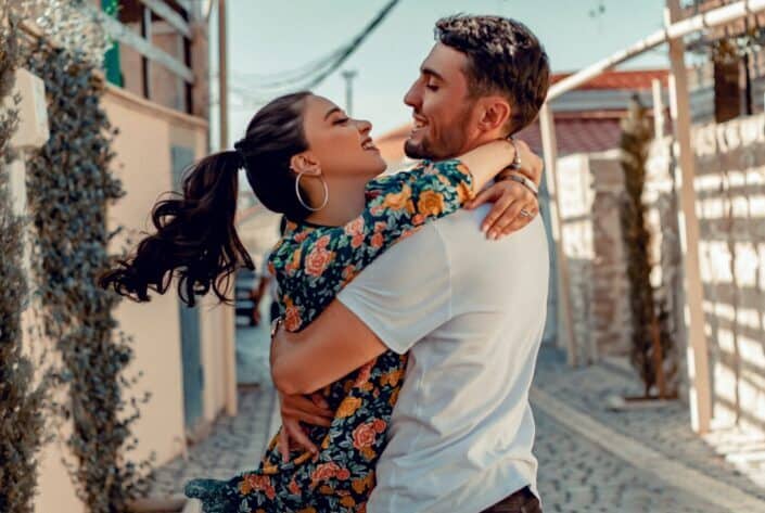 Loving couple cuddling on street