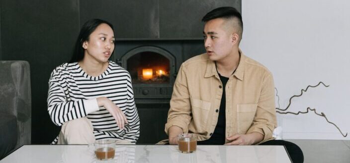 A Woman Sitting Next to a Man