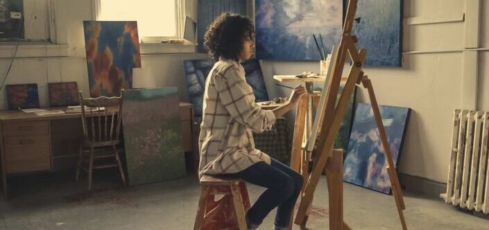 A creative woman doing a painting activity