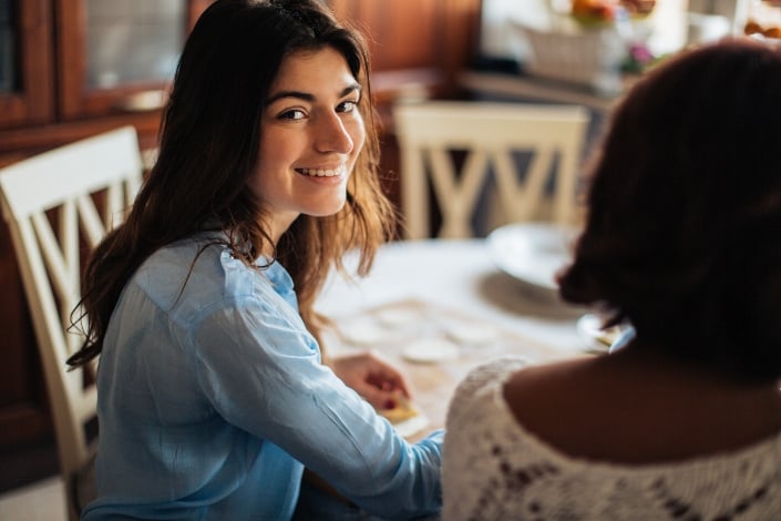 Woman in Blue Dress Shirt Smiling