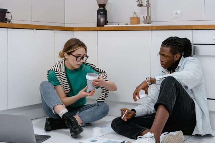 couple enjoying each other's company while working on the floor.