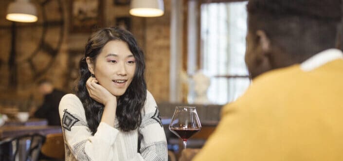 multi-racial couple having a date in a restaurant