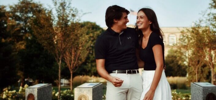 couple in couple outfit giggling at daylight