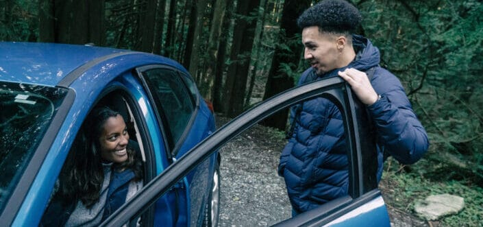 Woman inside the car talking to a guy