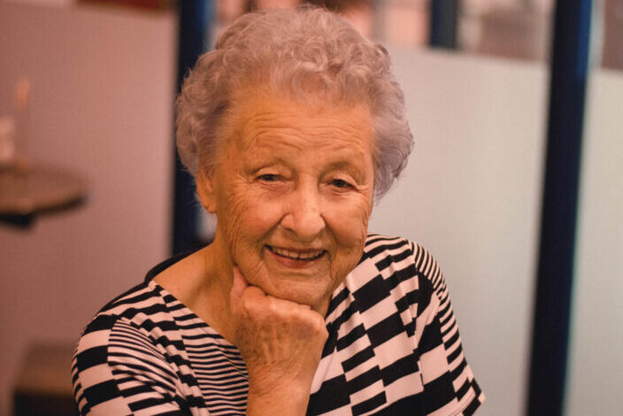 Old Woman Resting Head on Right Hand