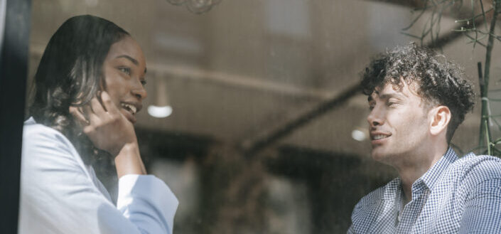 Man and Woman Talking Near the Window