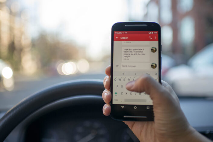 Person Inside Car With Smartphone Turned on