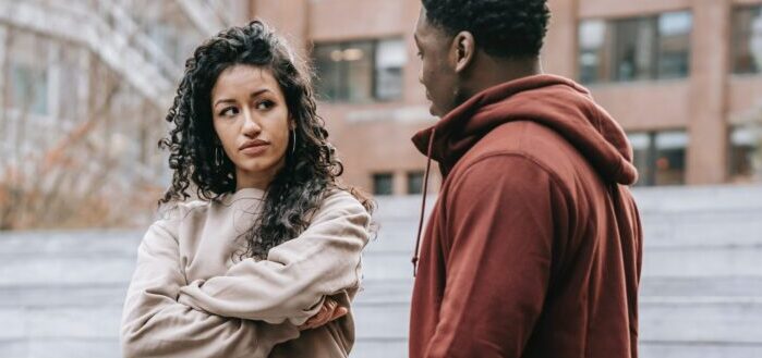 Couple having argument on street.