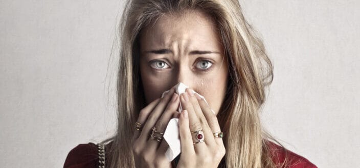 Crying Woman in Blowing Her Nose