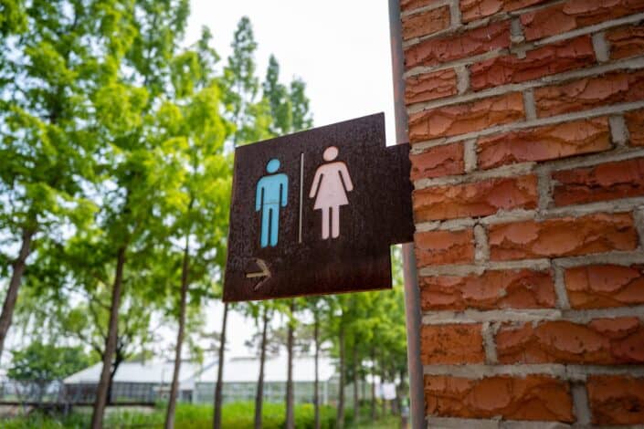 A public toilet sign board