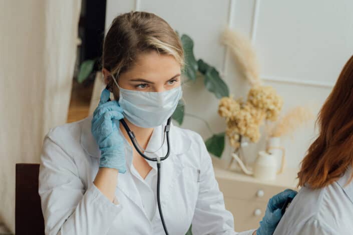 doctor checking up her patient