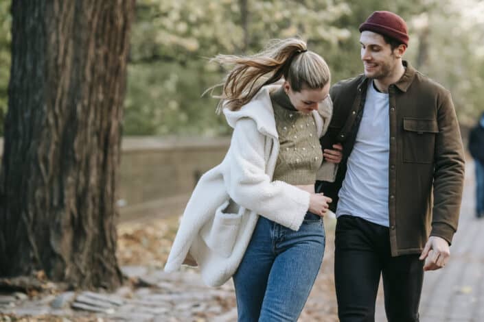 Couple walking on the street laughing