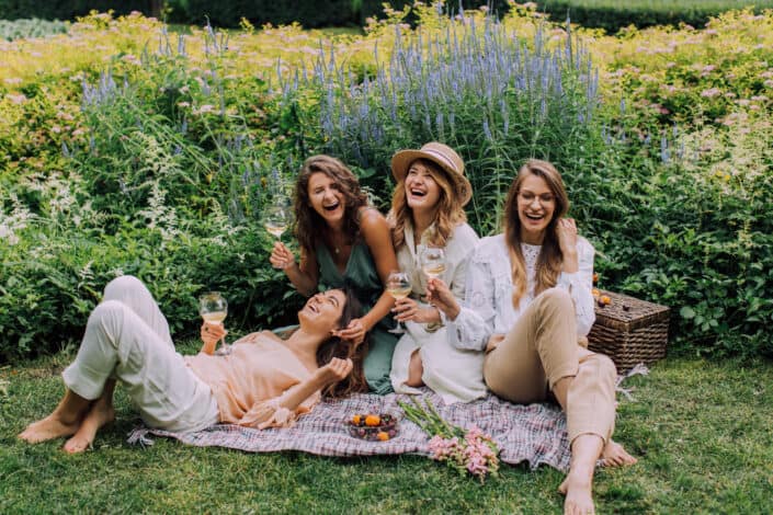 Four women having fun on a picnic