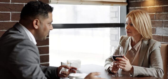 two colleagues talking about work