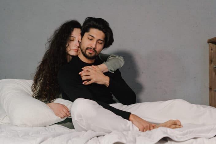 Man being hugged by his woman